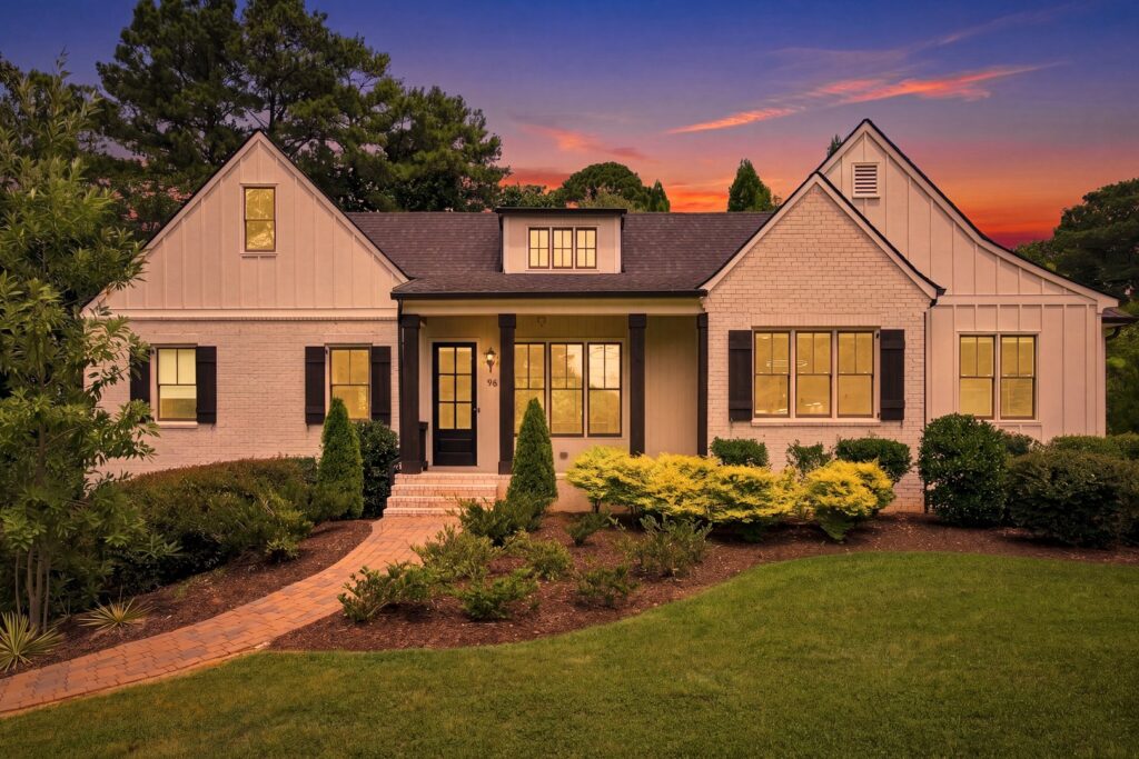 96 Woodstock Road luxury home for sale in Roswell, GA — front exterior at dusk