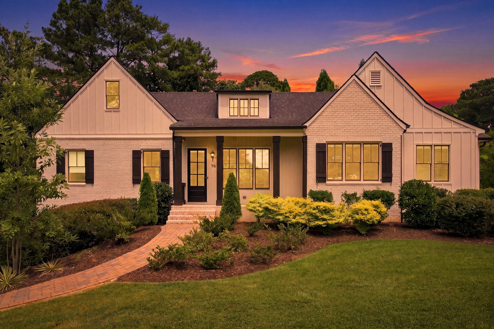 96 Woodstock Road luxury home for sale in Roswell, GA — front exterior at dusk